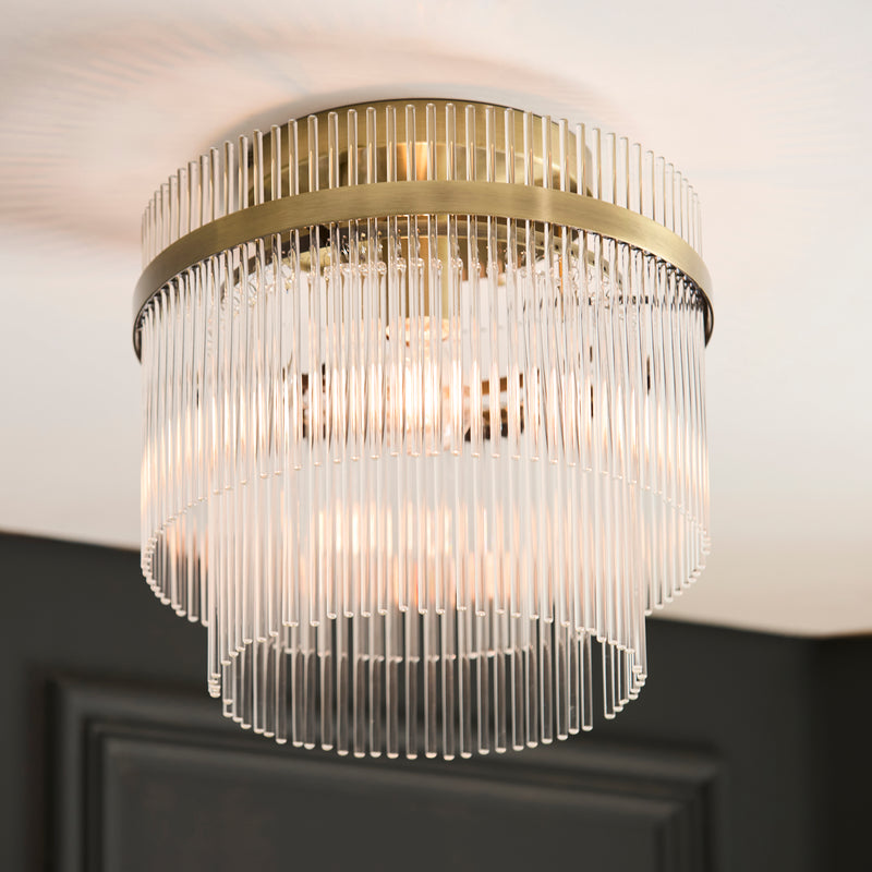 Marietta Flush Ceiling Light in antique brass shown in a room setting