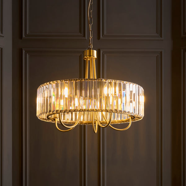 Visconti 5 Light Chandelier in antique brass shown in a room setting