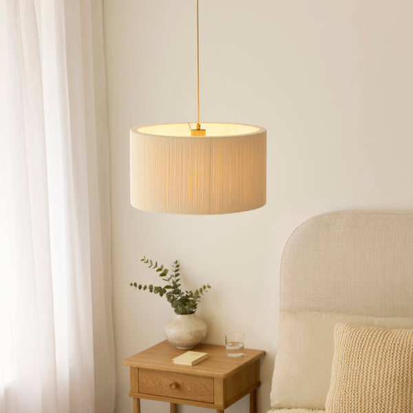Noah Pendant lit up in a styled living room