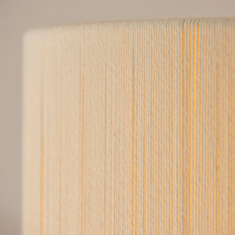 Detail of the brushed brass and cream cotton finish on the Noah Pendant