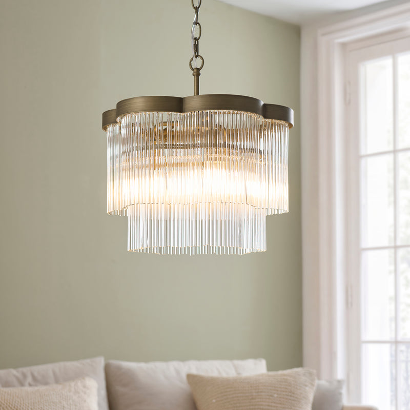 Lucille 3 Light Chandelier in antique brass shown in a room setting