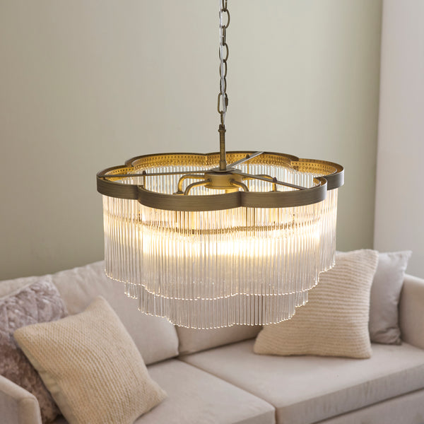 Lucille 5 Light Chandelier in antique brass shown in a room setting