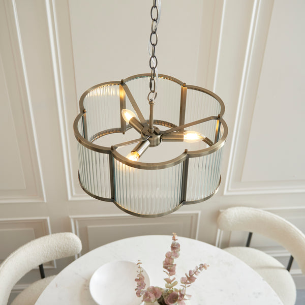 Ridgeton Scallop 3 Light Pendant in antique brass shown in a room setting