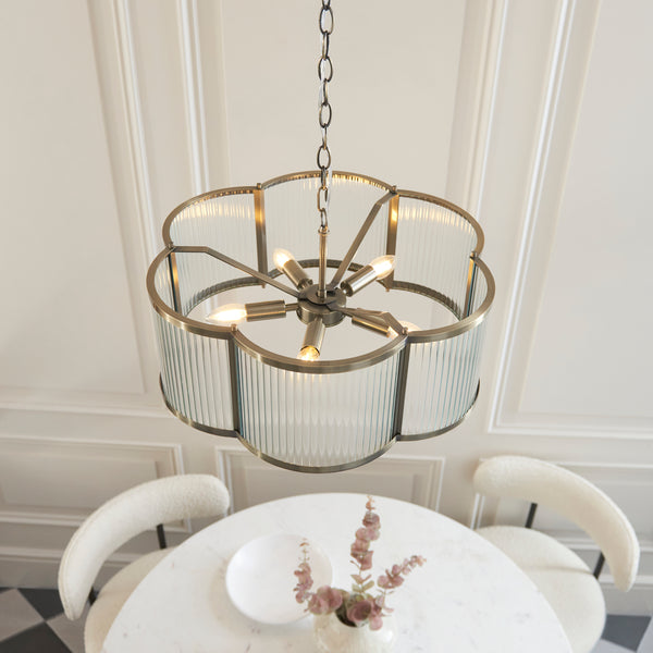 Ridgeton Scallop 5 Light Pendant in antique brass shown in a room setting