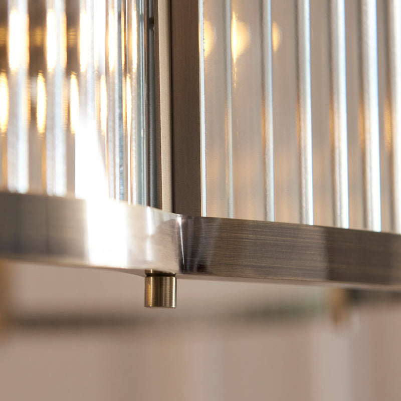 Detail of the antique brass finish on the Ridgeton Scallop 5 Light Pendant
