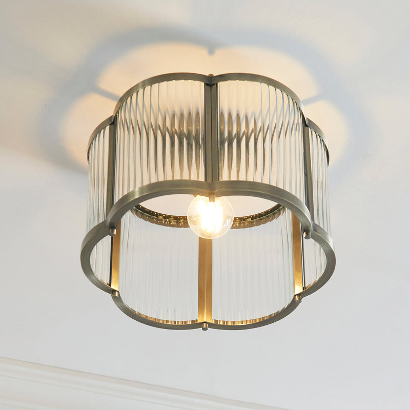 Ridgeton Scallop Flush Ceiling Light in antique brass shown in a room setting