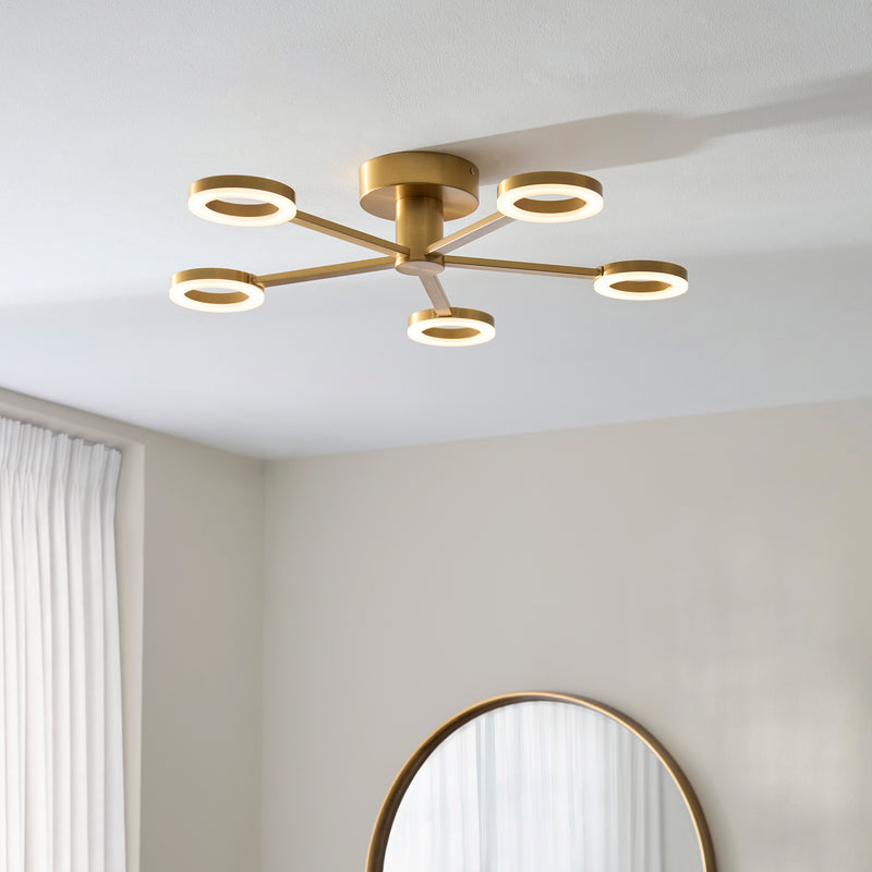 Scout 5 Light LED Semi Flush Ceiling Light in warm brass on a living room ceiling