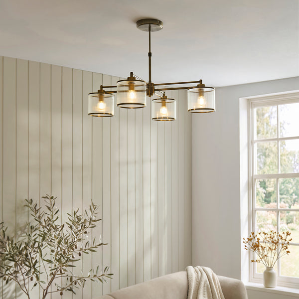 Ridgeton 4 Light Pendant in antique brass hanging in a dining room