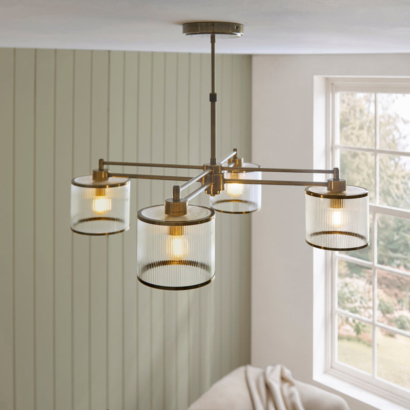 Ridgeton 4 Light Pendant in antique brass shown in a room setting