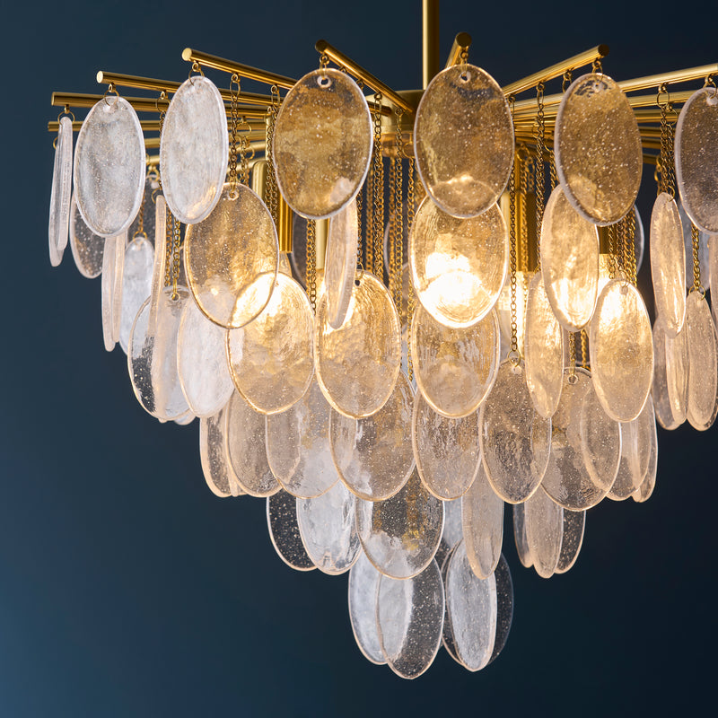 Loretta 5 Light Pendant in brushed aged brass shown in a room setting
