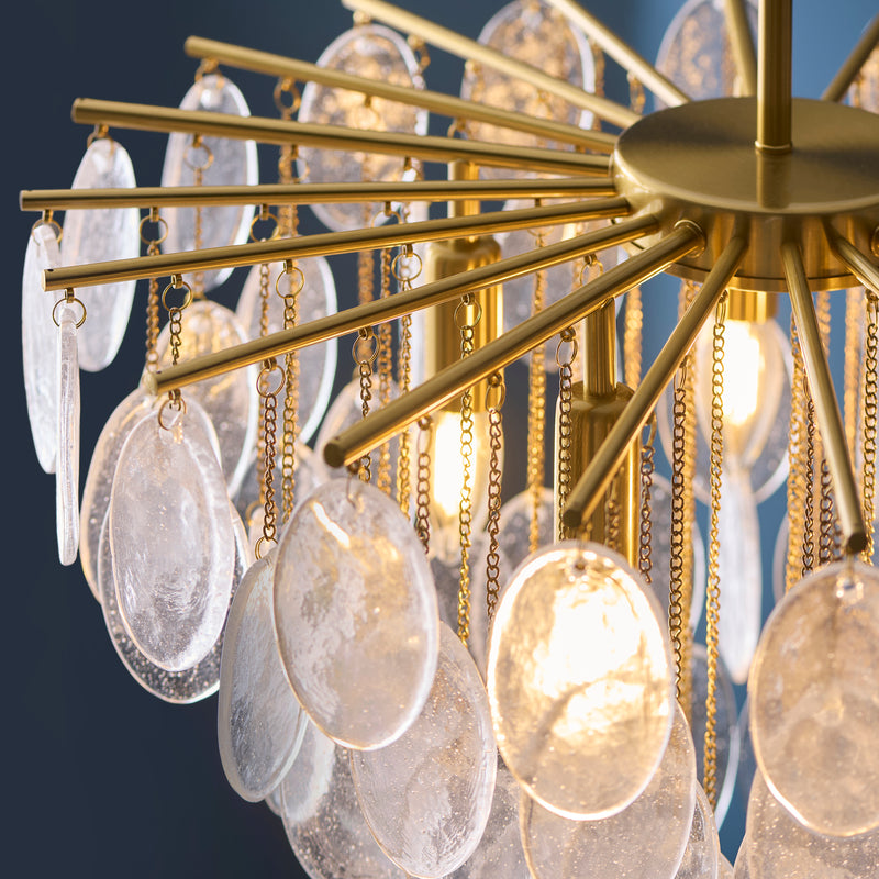 Detail of the brushed aged brass finish on the Loretta 5 Light Pendant