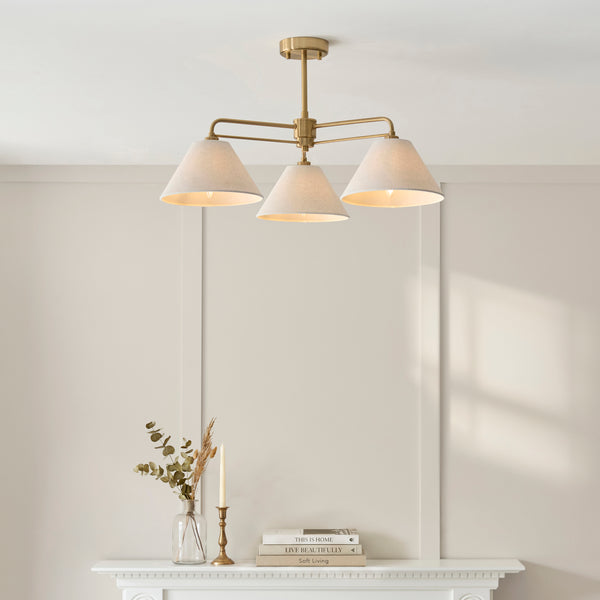 Wallbridge 3 Light Semi Flush Ceiling Light in brushed aged brass on a bedroom ceiling