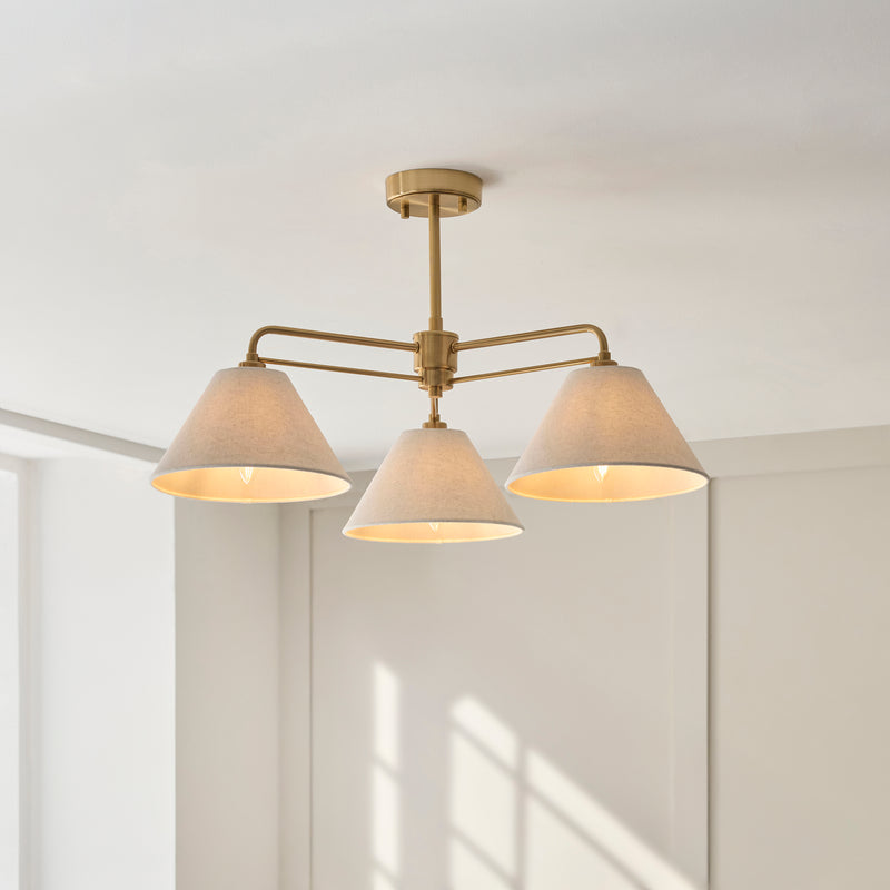 Wallbridge 3 Light Semi Flush Ceiling Light lit up in a styled bedroom