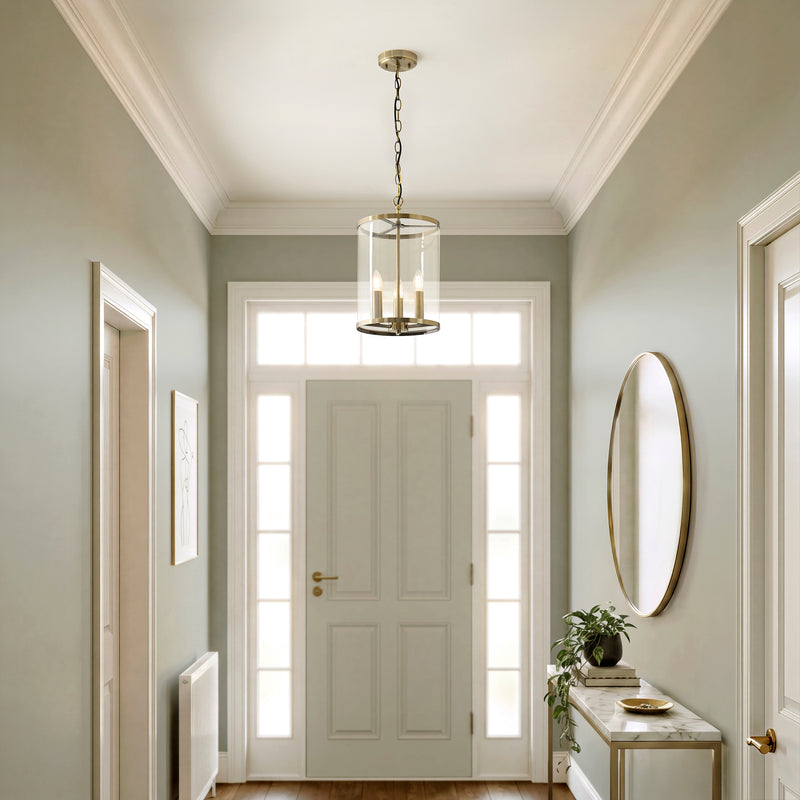 Hebden 3 Light Pendant in antique brass hanging in a hallway