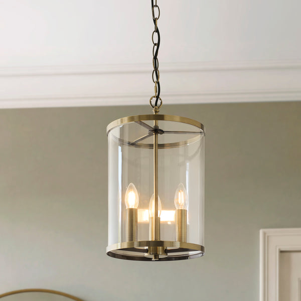 Hebden 3 Light Pendant lit up in a styled hallway
