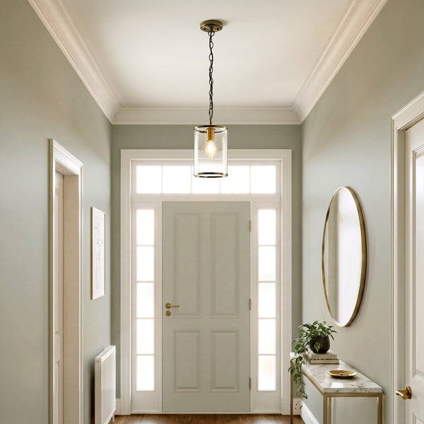 Hebden Pendant in antique brass hanging in a hallway
