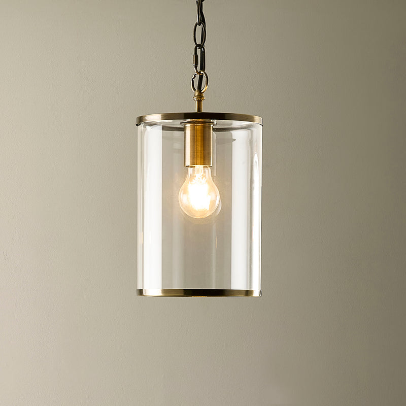 Hebden Pendant in antique brass shown in a room setting