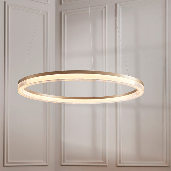 Lansina LED Hoop Pendant in brushed gold shown in a room setting
