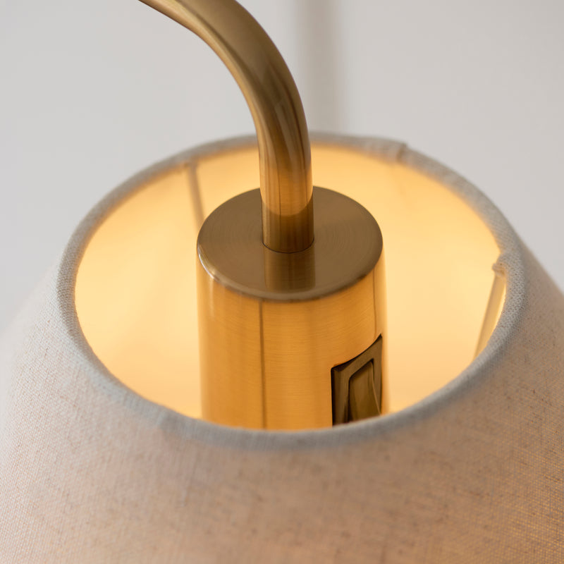 Detail of the aged brass and white marble finish on the Wallbridge Floor Lamp