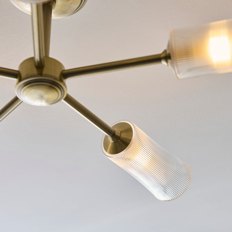 Avelyn 5 Light Semi Flush Ceiling Light in antique brass shown in a room setting