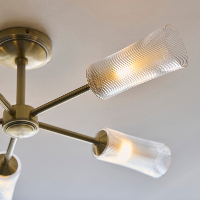 Close-up of the clear ribbed glass on the Avelyn 5 Light Semi Flush Ceiling Light