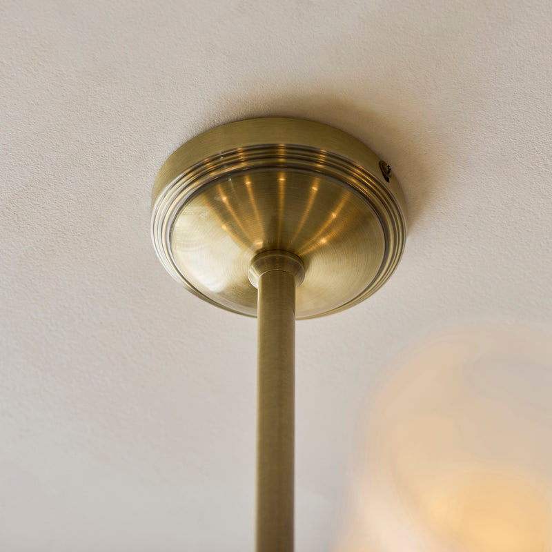 Close-up of the Avelyn 8 Light Chandelier ceiling plate and fittings