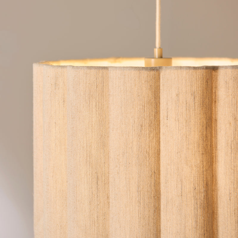 Olson Pendant in oak and natural fabric shown in a room setting