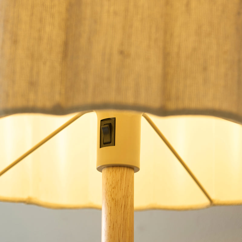 Olson Floor Lamp lit up in a bedroom setting