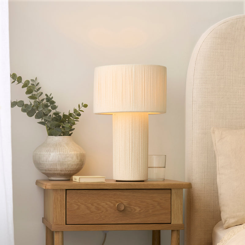 Noah Table Lamp lit up in a bedroom setting