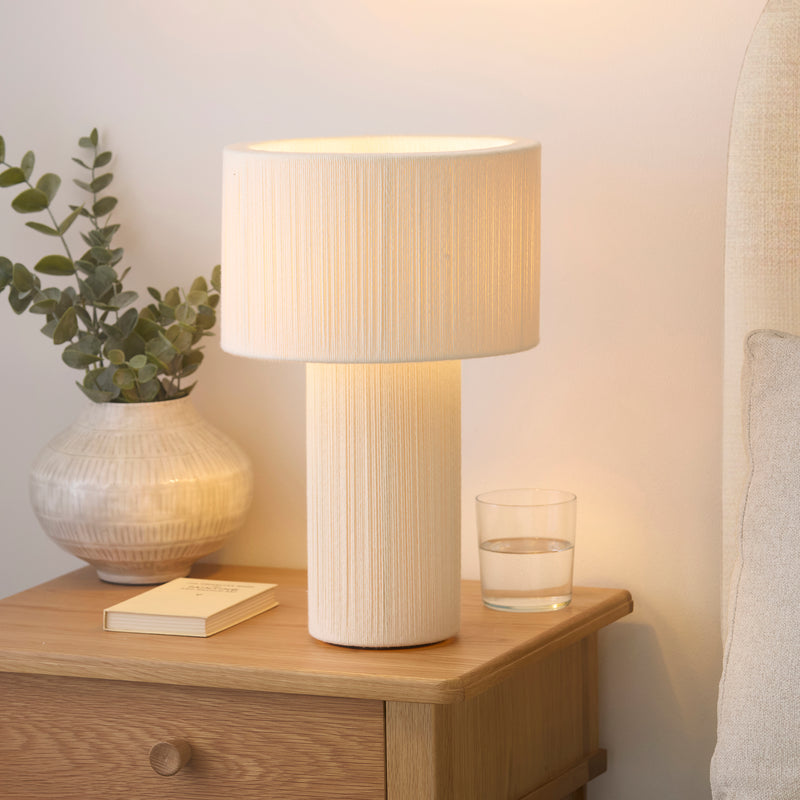Noah Table Lamp lit up in a bedroom setting