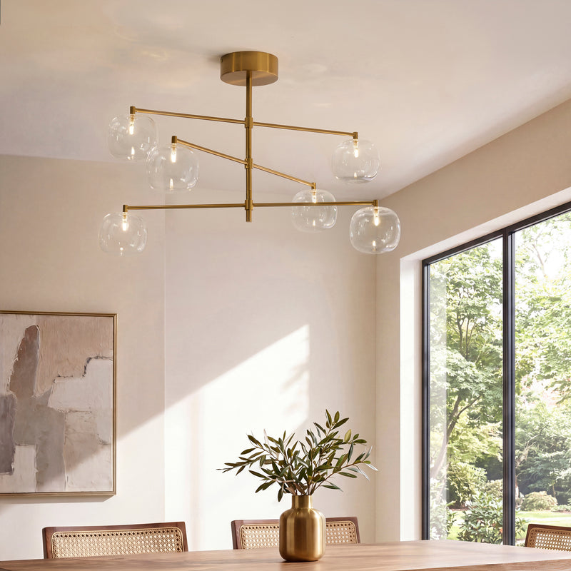 Oslo 6 Light Linear Pendant in brushed aged brass on a dining room ceiling