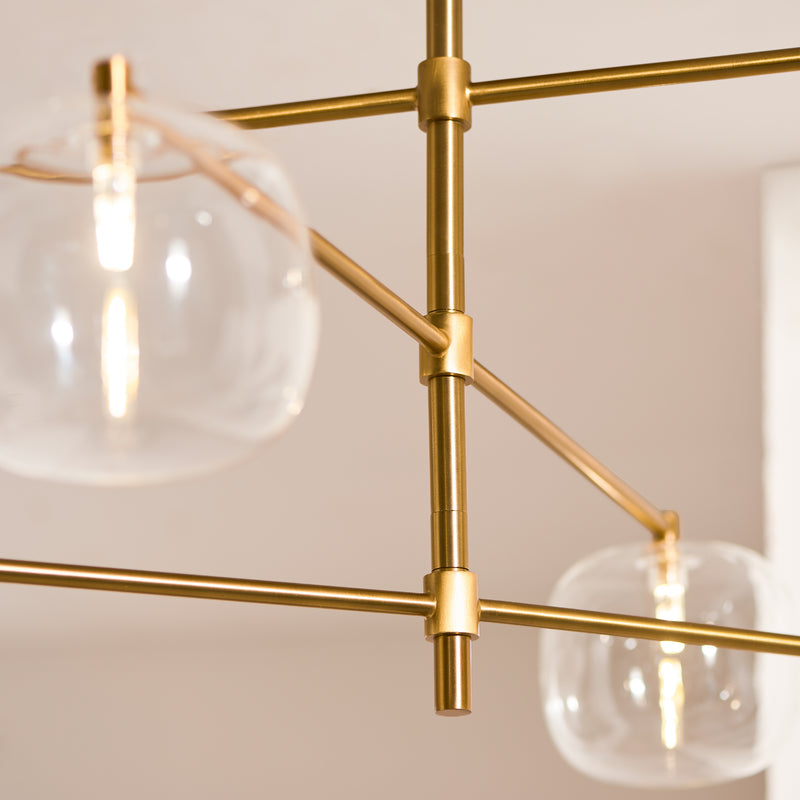 Detail of the brushed aged brass finish on the Oslo 6 Light Linear Pendant