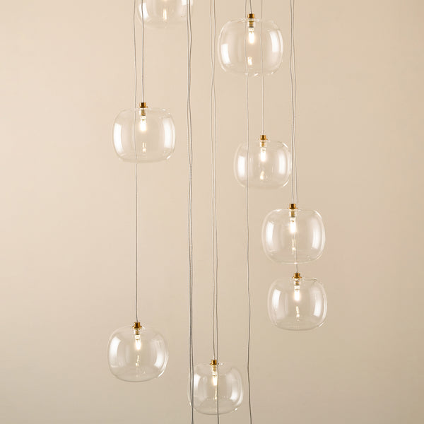 Oslo 12 Light Cascade Pendant lit up in a styled stairwell