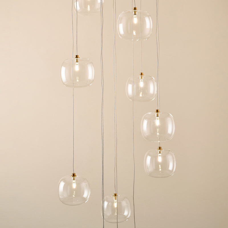 Oslo 12 Light Cascade Pendant lit up in a styled stairwell