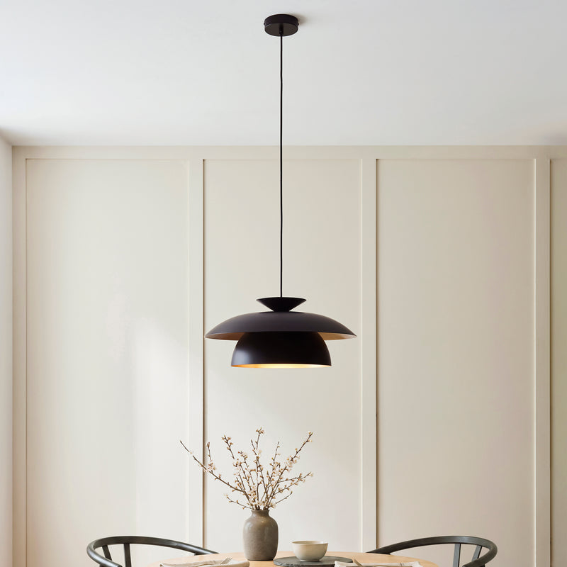 Lyon Pendant in matt black hanging in a dining room