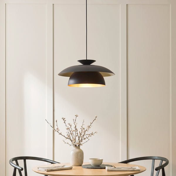 Lyon Pendant lit up in a styled dining room