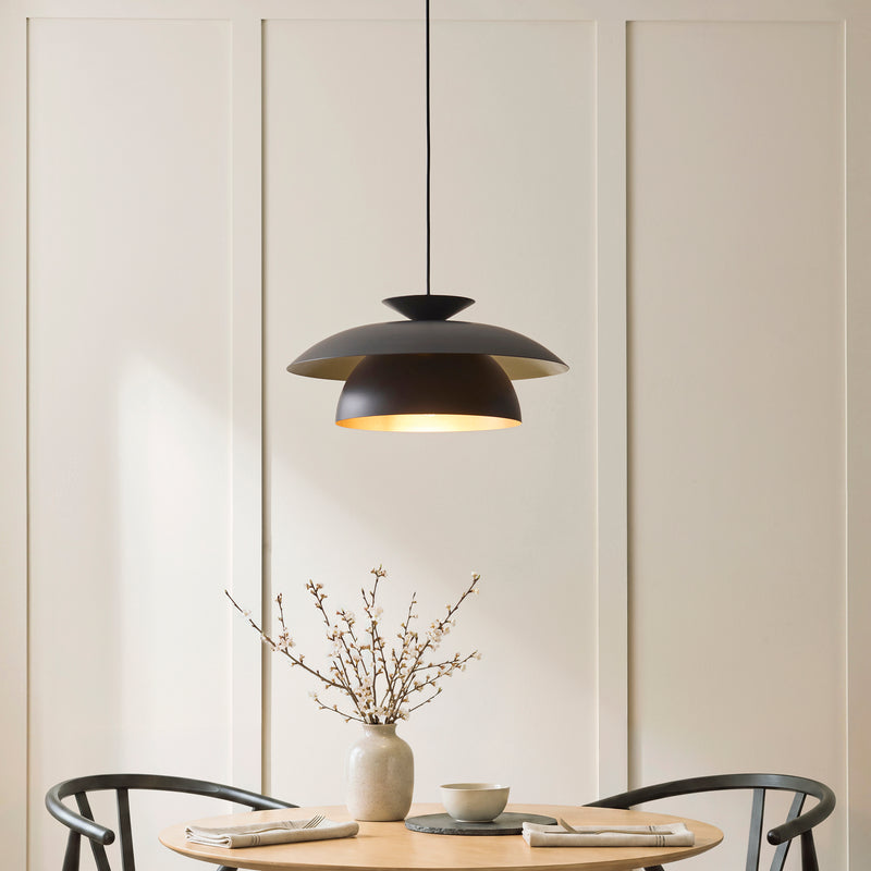 Lyon Pendant lit up in a styled dining room