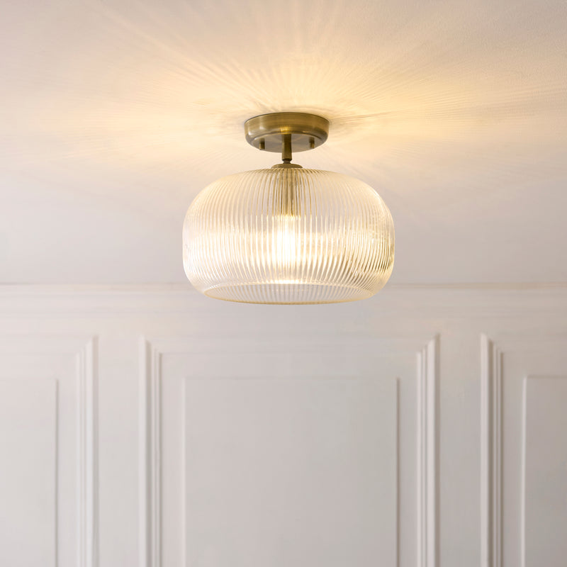 Harborne Flush Ceiling Light in antique brass on a hallway ceiling
