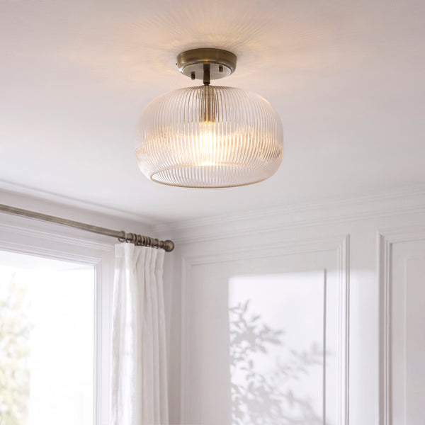 Harborne Flush Ceiling Light lit up in a styled hallway