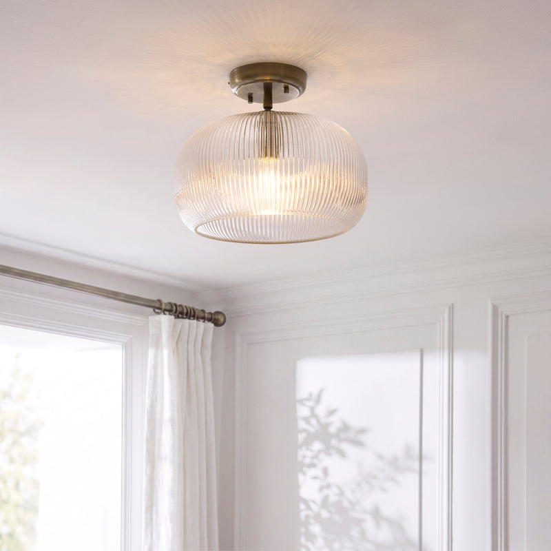 Harborne Flush Ceiling Light lit up in a styled hallway