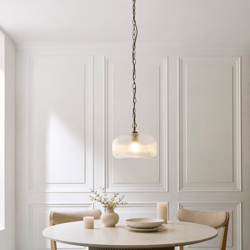 Harborne Pendant in antique brass hanging in a kitchen