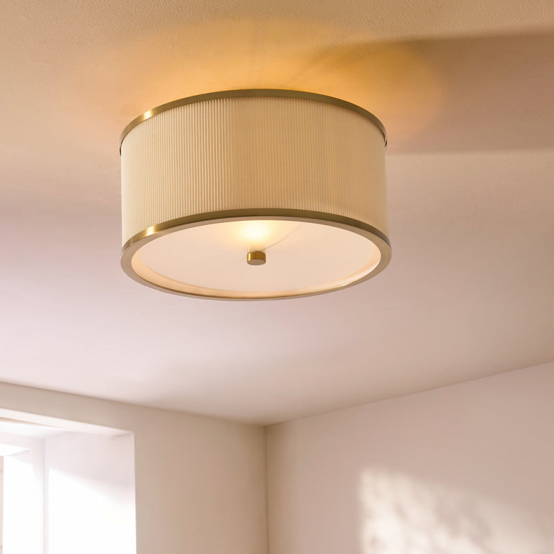 Lexi Flush Ceiling Light in aged brass and ivory on a bedroom ceiling