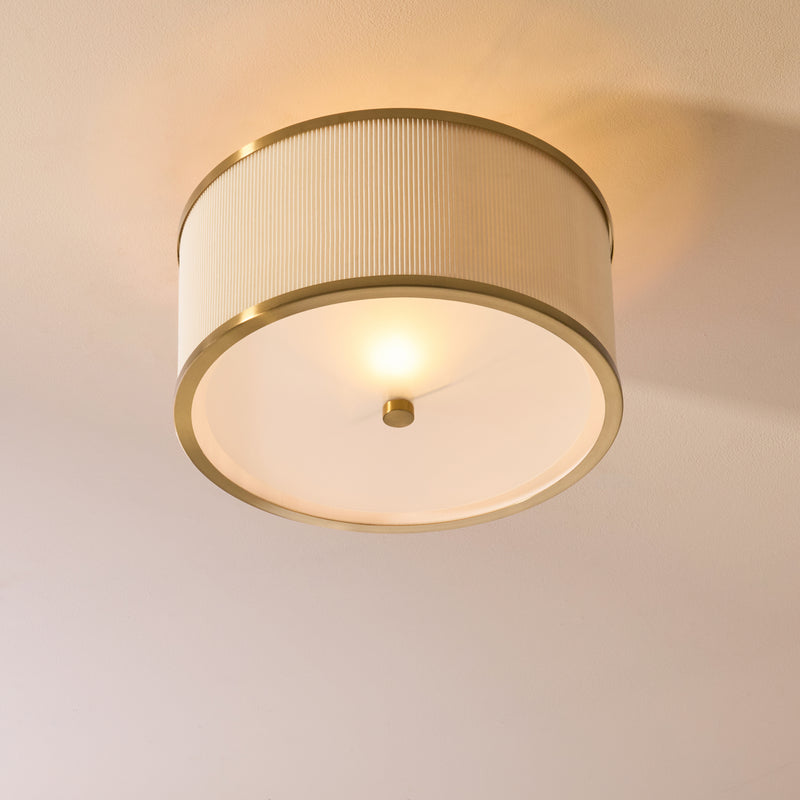 Lexi Flush Ceiling Light lit up in a styled bedroom