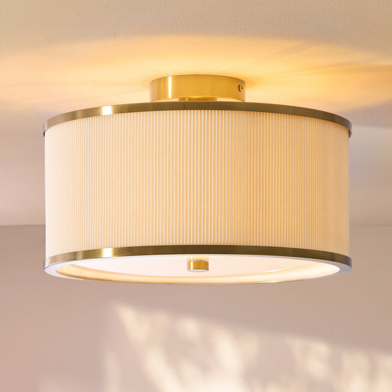 Lexi Flush Ceiling Light in aged brass and ivory shown in a room setting