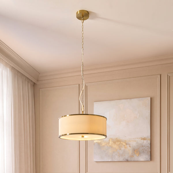 Lexi 3 Light Pendant lit up in a styled bedroom