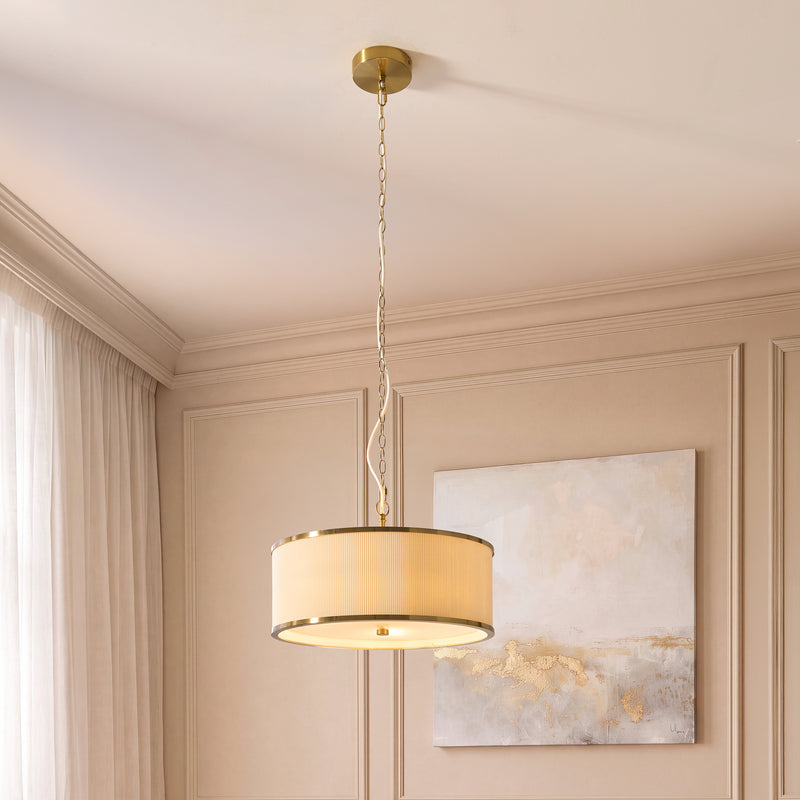 Lexi 3 Light Pendant lit up in a styled bedroom