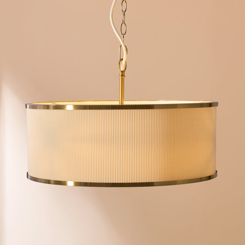 Lexi 3 Light Pendant in aged brass and ivory shown in a room setting