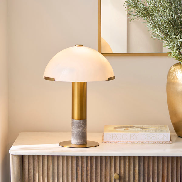 Endon Hansel Table Lamp in warm brass and grey marble in a styled bedroom