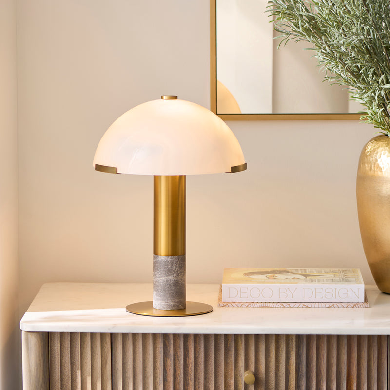 Endon Hansel Table Lamp in warm brass and grey marble in a styled bedroom