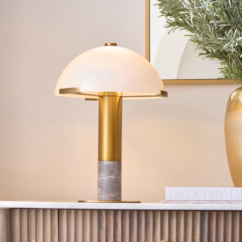 Hansel Table Lamp lit up in a bedroom setting
